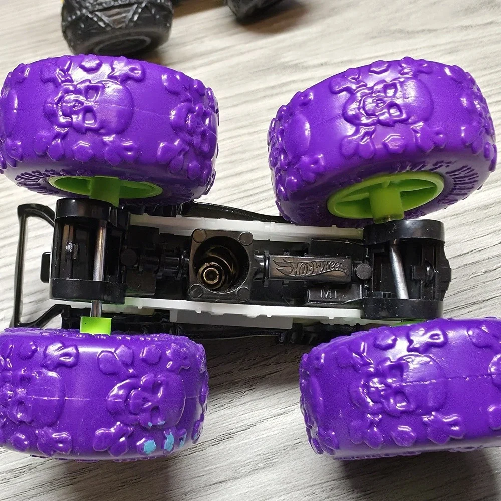 Hotwheels Monster Trucks Lot - Carbonator, Buns Of Steel, Unimog, And Tuk N Roll